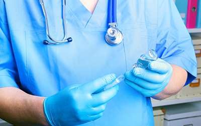 Syringe, medical injection, bottle, ampule in hand, palm or fingers. Medicine plastic vaccination equipment with needle. Nurse or doctor. Liquid drug or narcotic. Health care in hospital