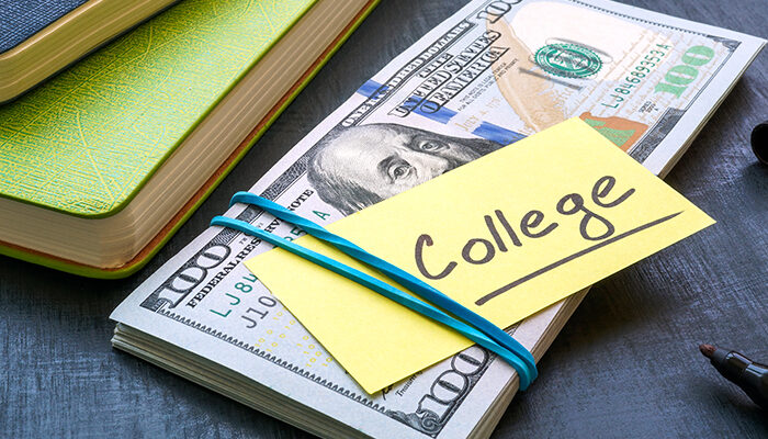 Bundle of money with the inscription college. Tuition payment.