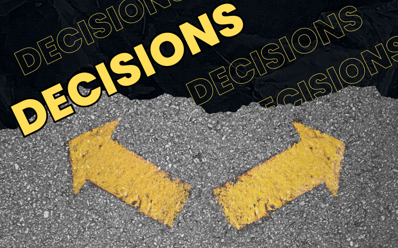 Image of two arrows on pavement pointing in opposite directions with the word "decisions" on top