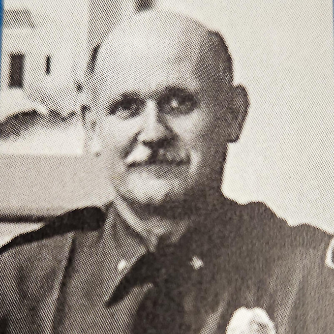portrait of mustached man in a uniform