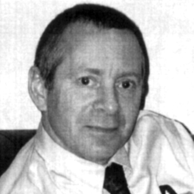 black and white photo of a middle-aged man with short hair