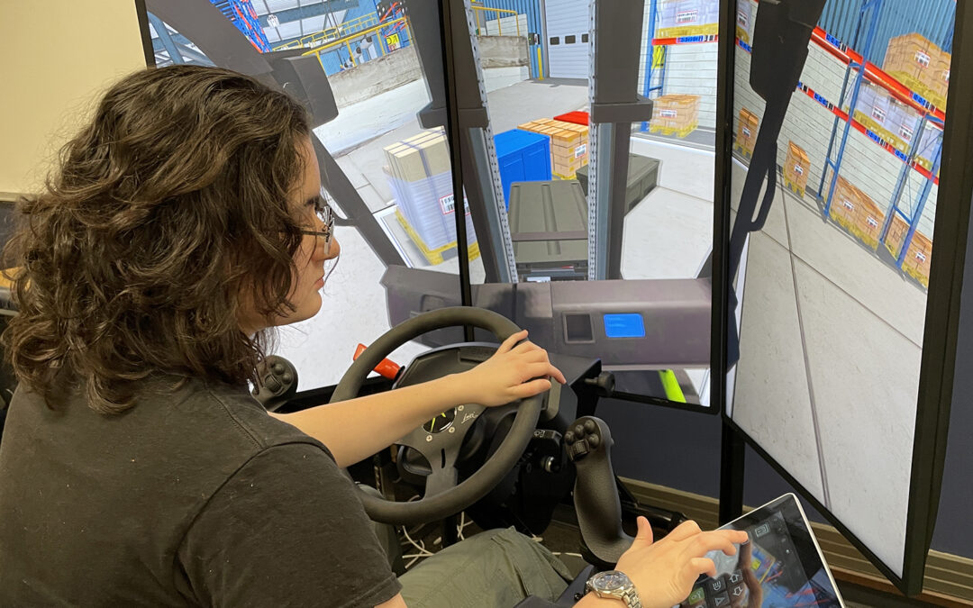 woman using a heavy equipment simulator