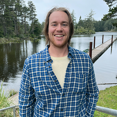 Larry-Tilley-400x400 Portrait of a man in front of a lake