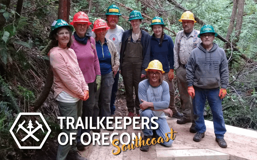 Image of a group of nine people wearing hard hats, standing on a trail in the woods. Text over image says: Trailkeepers of Oregon.