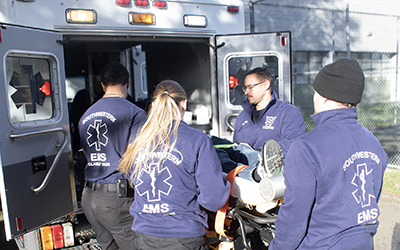 image of vegetables and a man tilling a field in the background