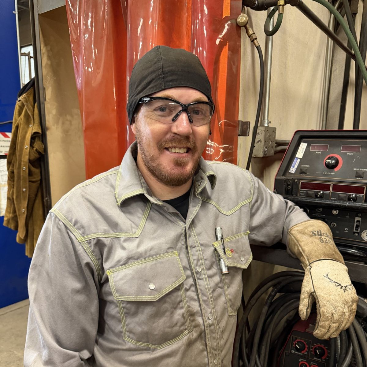 Casey Welding Profile photo of welding instructor, Casey Garaventa, standing in the welding shop